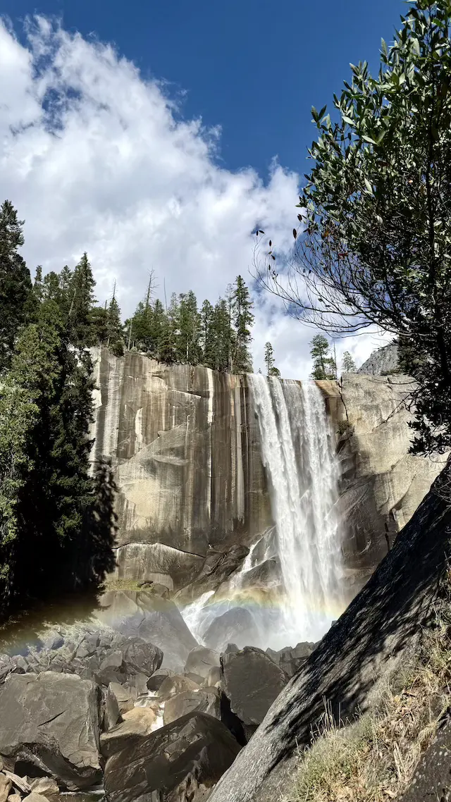 A waterfall on a shaded trail